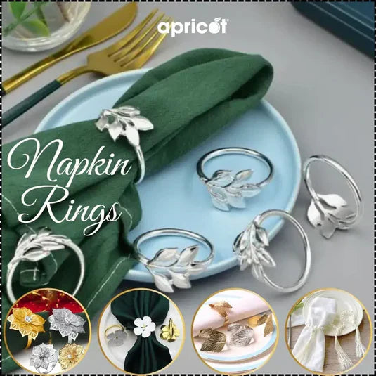 Collection of stylish napkin holders and rings in various designs and finishes, neatly arranged to highlight their elegance and craftsmanship for enhancing any dining table decor